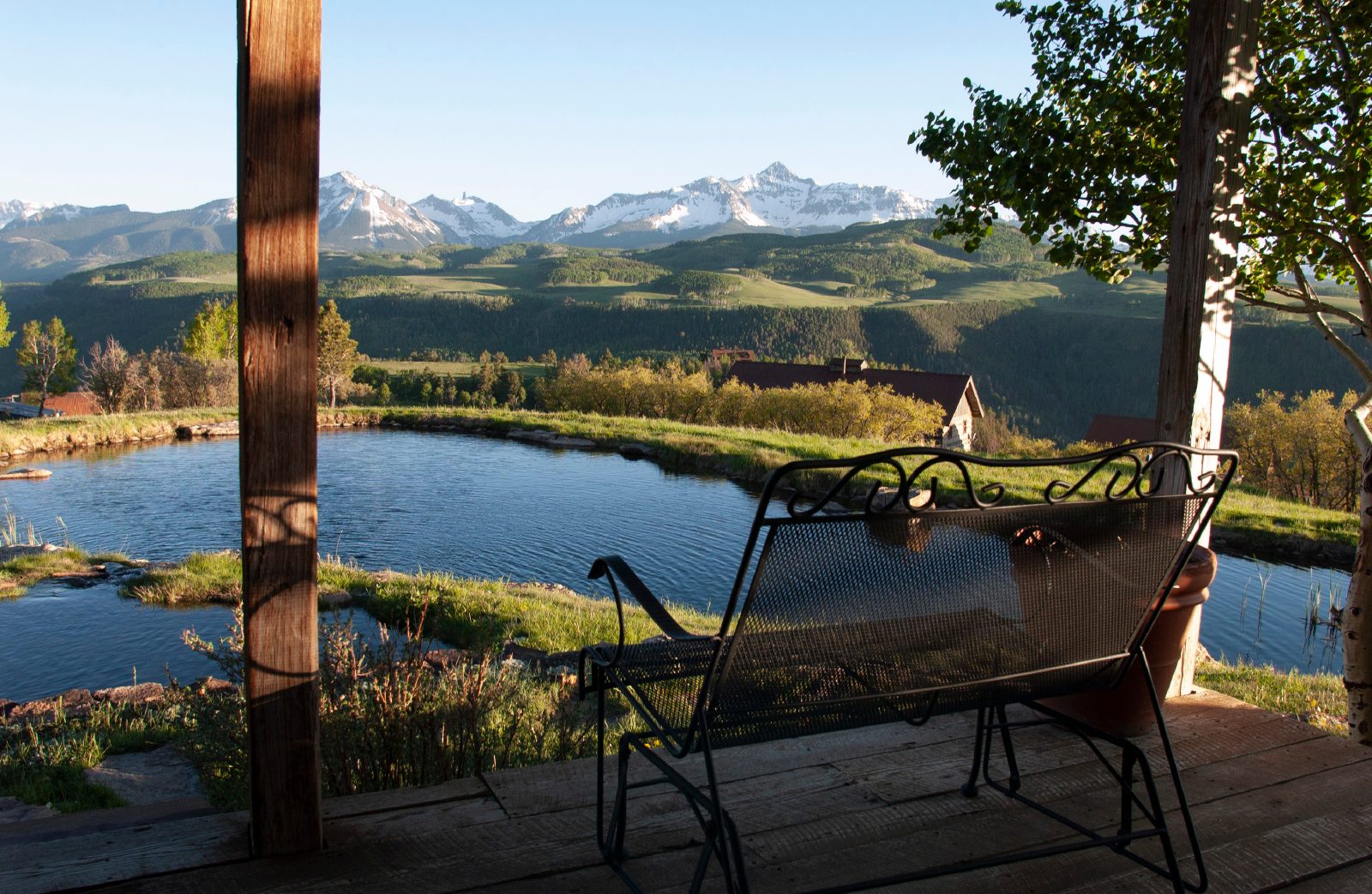 A porch with a sweeping mountain view at a Southwest Colorado home